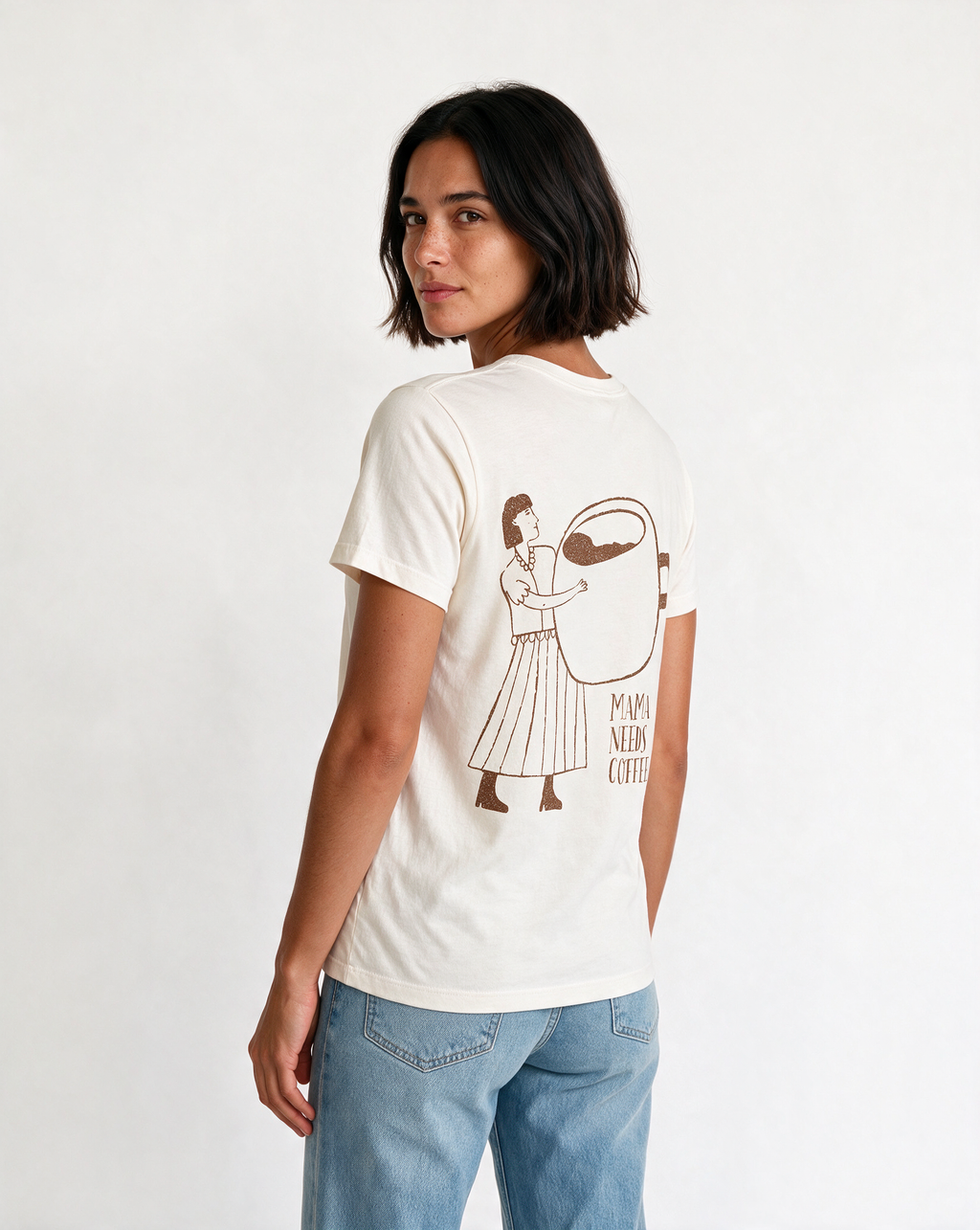 MAMA NEEDS COFFEE oversized graphic tee on model, studio lifestyle photograph, three-quarter back